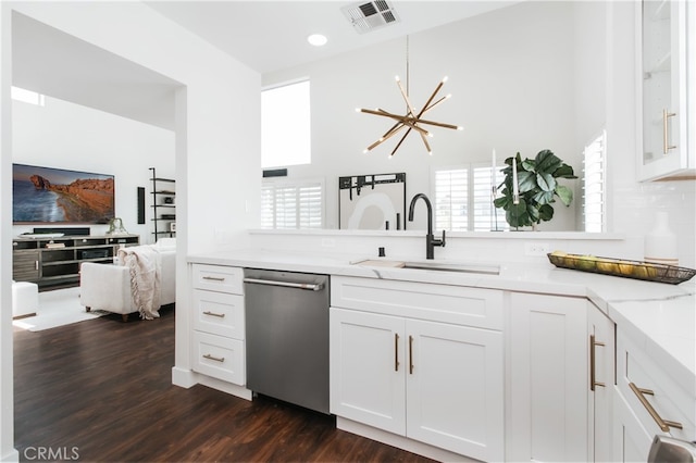1617 S Beverly Glen Blvd Unit 301, Los Angeles, CA 90024 - kitchen featuring dishwasher, a sink, a chandelier, dark wood finished floors, and light stone countertops