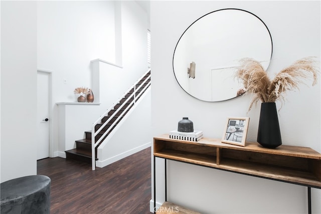 1617 S Beverly Glen Blvd Unit 301, Los Angeles, CA 90024 - stairway featuring wood finished floors and baseboards