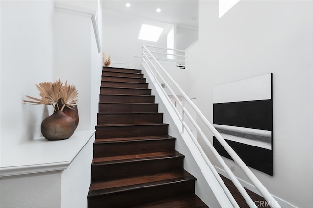 1617 S Beverly Glen Blvd Unit 301, Los Angeles, CA 90024 - stairway featuring recessed lighting and a skylight