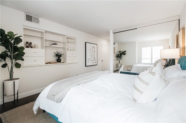 1617 S Beverly Glen Blvd Unit 301, Los Angeles, CA 90024 - bedroom featuring wood finished floors, a closet, and baseboards