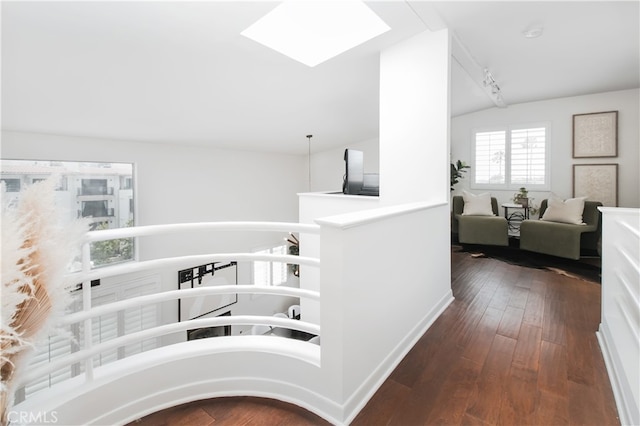 1617 S Beverly Glen Blvd Unit 301, Los Angeles, CA 90024 - corridor featuring vaulted ceiling, hardwood / wood-style flooring, and a skylight