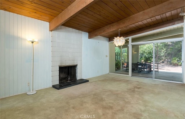 1560 Sheridan, Glendale, CA 91206 - unfurnished living room featuring wooden ceiling with exposed beams, a tile fireplace, carpet floors, and wood walls