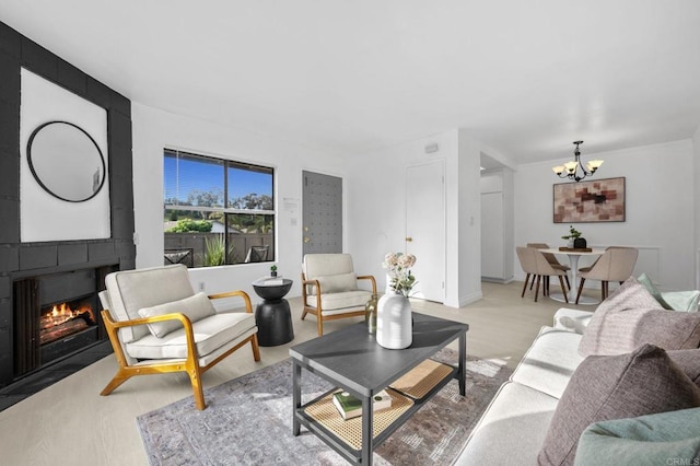 3468 Los Mochis Way, Oceanside, CA 92056 - living room with a chandelier and a large fireplace