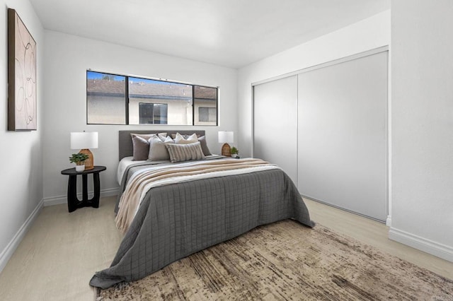 3468 Los Mochis Way, Oceanside, CA 92056 - bedroom with light wood finished floors, a closet, and baseboards