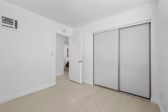 3468 Los Mochis Way, Oceanside, CA 92056 - unfurnished bedroom with wood finished floors, baseboards, and a closet