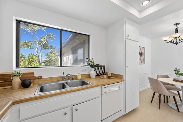 3468 Los Mochis Way, Oceanside, CA 92056 - kitchen with dishwasher, a sink, a chandelier, light countertops, and white cabinetry