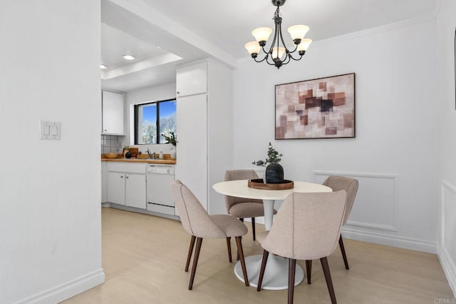 3468 Los Mochis Way, Oceanside, CA 92056 - dining space featuring a chandelier, baseboards, and light wood-style floors