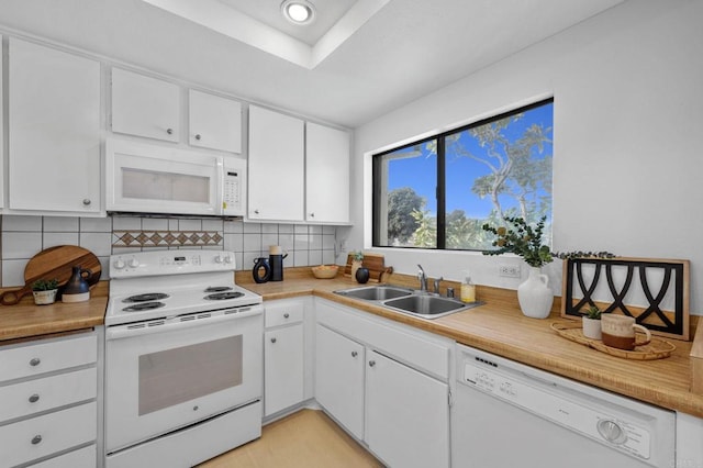 3468 Los Mochis Way, Oceanside, CA 92056 - kitchen with white appliances, a sink, tasteful backsplash, white cabinets, and light countertops