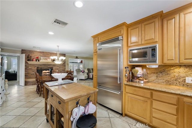210 View Dr, La Habra, CA 90631 - kitchen featuring built in appliances, plenty of natural light, open floor plan, tasteful backsplash, and recessed lighting