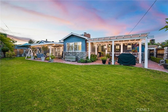 210 View Dr, La Habra, CA 90631 - back of house at dusk with a patio, a chimney, and a pergola