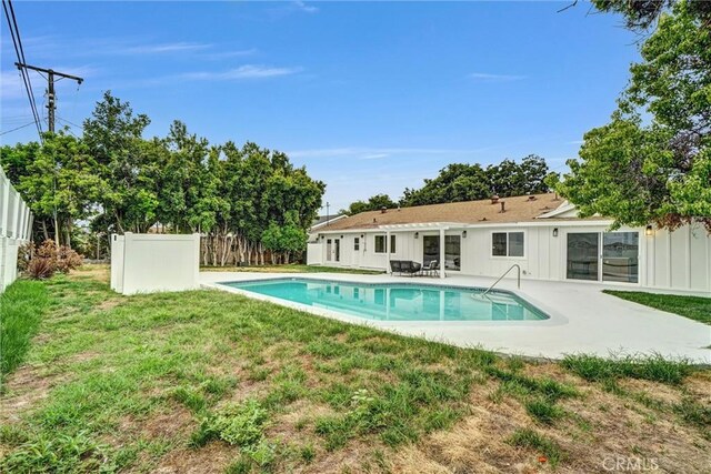 2842 E Virginia Ave, Anaheim, CA 92806 - back of house featuring board and batten siding and a patio