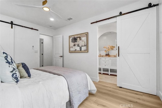 2842 E Virginia Ave, Anaheim, CA 92806 - bedroom with a barn door, light wood-style floors, recessed lighting, and a ceiling fan