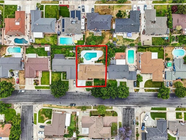 2842 E Virginia Ave, Anaheim, CA 92806 - aerial perspective of suburban area with a pool and property parcel outlined