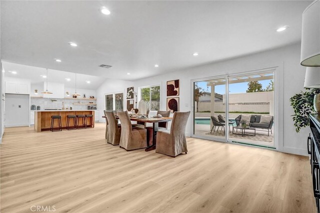 2842 E Virginia Ave, Anaheim, CA 92806 - dining area featuring light wood-style flooring, vaulted ceiling, and recessed lighting