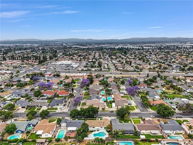 2842 E Virginia Ave, Anaheim, CA 92806 - aerial perspective of suburban area with a mountain backdrop and a pool area