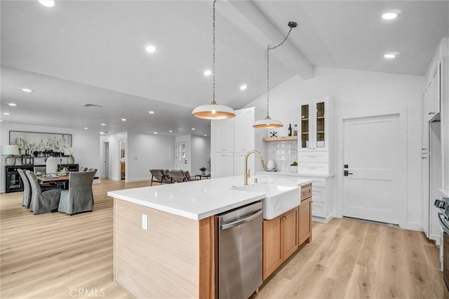 2842 E Virginia Ave, Anaheim, CA 92806 - kitchen with dishwasher, a sink, light wood finished floors, a center island with sink, and light countertops
