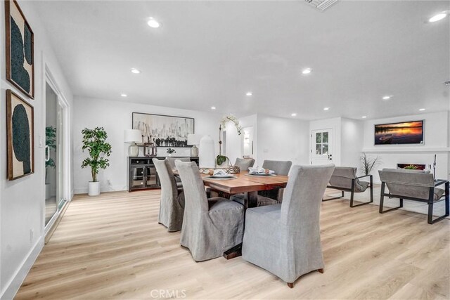 2842 E Virginia Ave, Anaheim, CA 92806 - dining area featuring light wood finished floors, recessed lighting, and baseboards
