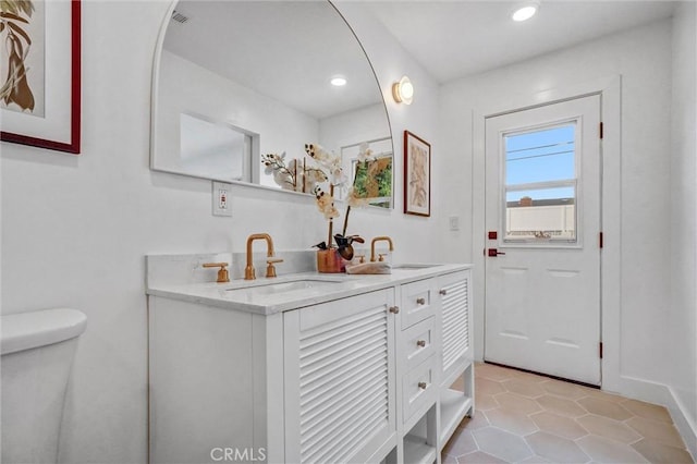 2842 E Virginia Ave, Anaheim, CA 92806 - doorway featuring a sink, light tile patterned floors, recessed lighting, and baseboards
