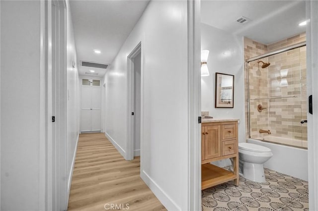 2842 E Virginia Ave, Anaheim, CA 92806 - full bathroom with vanity, shower / bath combination with glass door, toilet, wood finished floors, and recessed lighting