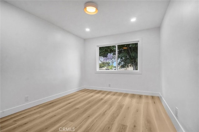 2842 E Virginia Ave, Anaheim, CA 92806 - unfurnished room featuring baseboards, light wood-type flooring, and recessed lighting