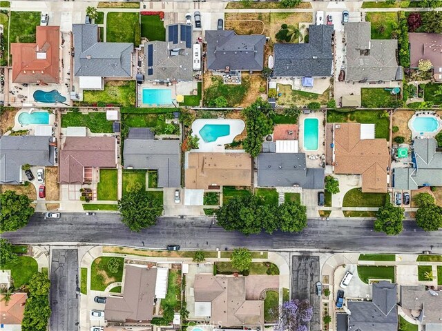 2842 E Virginia Ave, Anaheim, CA 92806 - aerial overview of property's location featuring a pool area and nearby suburban area