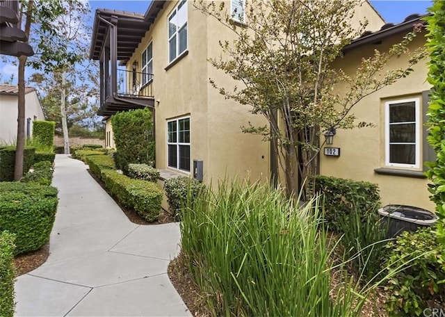 4304 Owens St Unit 102, Corona, CA 92883 - view of side of property with stucco siding and a balcony
