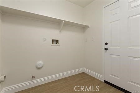 4304 Owens St Unit 102, Corona, CA 92883 - laundry area featuring wood finished floors, washer hookup, and hookup for a gas dryer