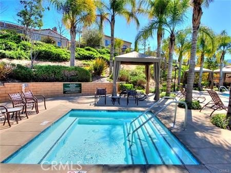 4304 Owens St Unit 102, Corona, CA 92883 - view of pool featuring a gazebo, a pool, and a patio area