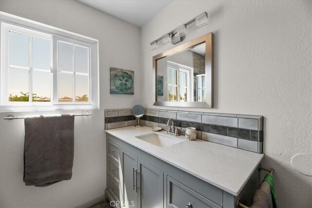 22025 Del Oro Rd, Apple Valley, CA 92308 - bathroom featuring backsplash and vanity
