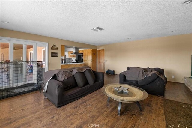22025 Del Oro Rd, Apple Valley, CA 92308 - living room featuring a textured ceiling and wood finished floors