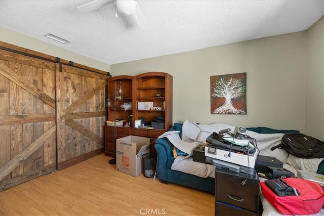 22025 Del Oro Rd, Apple Valley, CA 92308 - bedroom with wood finished floors, a textured ceiling, and ceiling fan