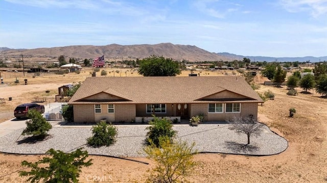 22025 Del Oro Rd, Apple Valley, CA 92308 - rear view of property with a gate, brick siding, and a mountain view