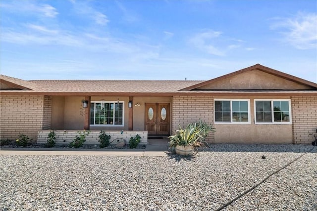 22025 Del Oro Rd, Apple Valley, CA 92308 - single story home with brick siding, roof with shingles, and stucco siding