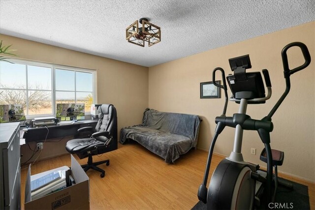 22025 Del Oro Rd, Apple Valley, CA 92308 - office with a textured ceiling and wood finished floors