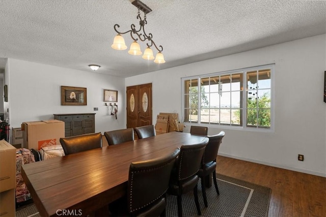 22025 Del Oro Rd, Apple Valley, CA 92308 - dining space featuring a textured ceiling, wood finished floors, and baseboards