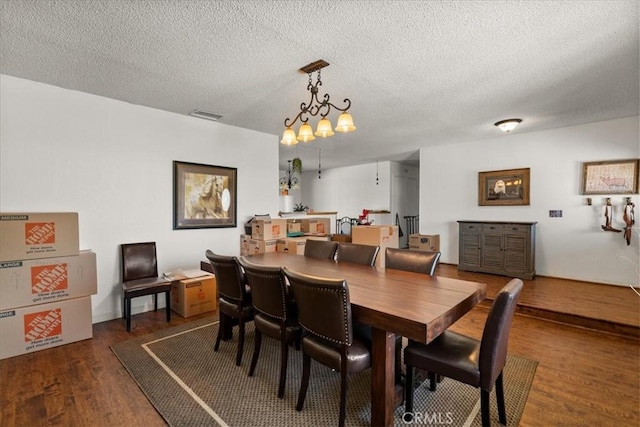22025 Del Oro Rd, Apple Valley, CA 92308 - dining room featuring wood finished floors and a textured ceiling