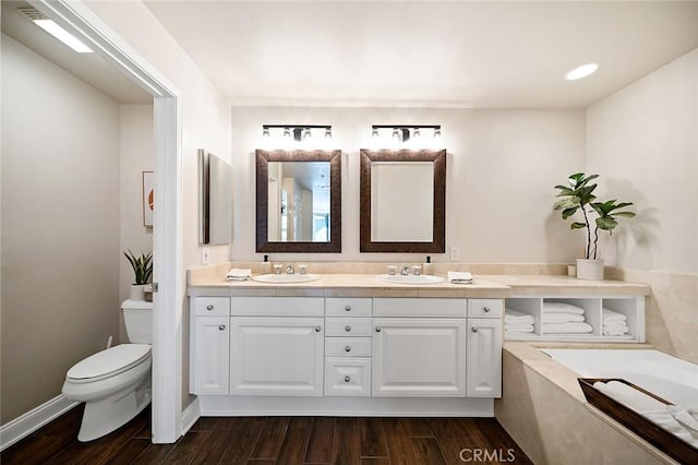 1500 E Ocean Blvd Unit 419, Long Beach, CA 90802 - full bath with double vanity, a garden tub, wood finished floors, and toilet