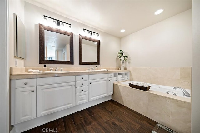 1500 E Ocean Blvd Unit 419, Long Beach, CA 90802 - bathroom with double vanity, a bath, wood finished floors, and recessed lighting