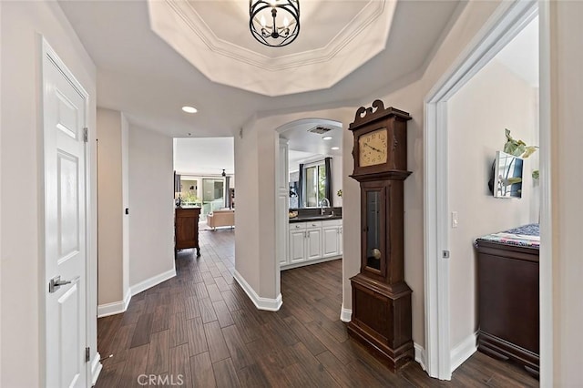 1500 E Ocean Blvd Unit 419, Long Beach, CA 90802 - corridor featuring arched walkways, dark wood finished floors, baseboards, recessed lighting, and a chandelier