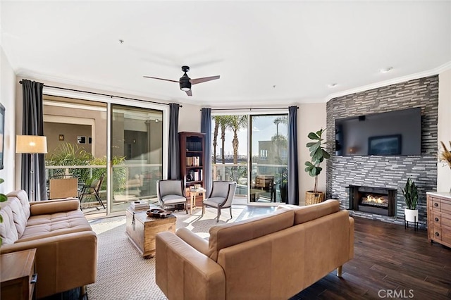 1500 E Ocean Blvd Unit 419, Long Beach, CA 90802 - living room featuring dark wood-style flooring, a ceiling fan, a fireplace, and ornamental molding