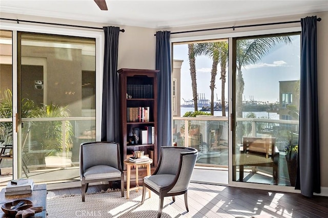 1500 E Ocean Blvd Unit 419, Long Beach, CA 90802 - living area featuring a water view, ornamental molding, and wood finished floors