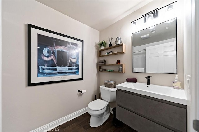 1500 E Ocean Blvd Unit 419, Long Beach, CA 90802 - bathroom with toilet, vanity, wood finished floors, and baseboards