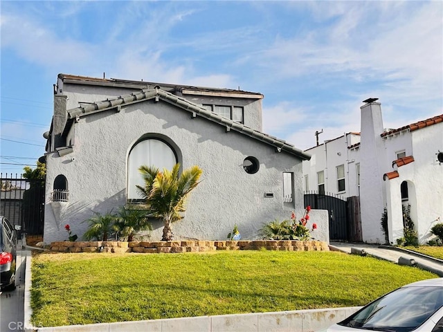 3208 W 74th St, Los Angeles, CA 90043 - view of front facade with a gate and stucco siding
