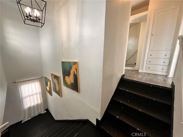 3208 W 74th St, Los Angeles, CA 90043 - stairway featuring wood finished floors and a chandelier