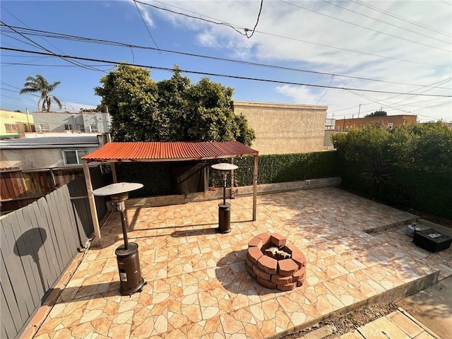 3208 W 74th St, Los Angeles, CA 90043 - fenced backyard with an outdoor fire pit and a patio