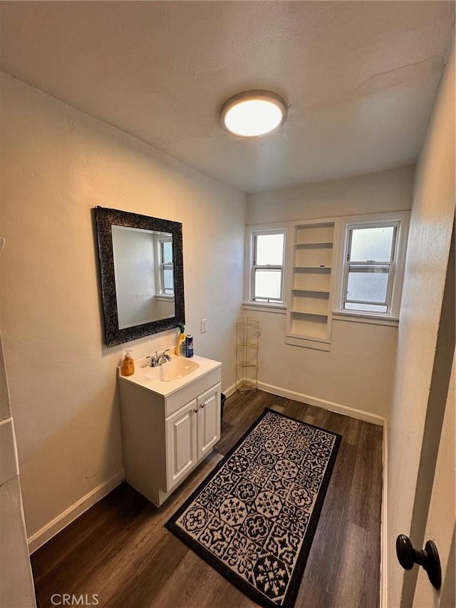 3208 W 74th St, Los Angeles, CA 90043 - bathroom with vanity and wood finished floors