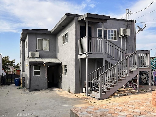 3208 W 74th St, Los Angeles, CA 90043 - view of front facade with stucco siding, stairs, and a patio