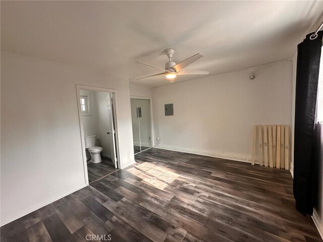 3208 W 74th St, Los Angeles, CA 90043 - unfurnished bedroom with dark wood-style flooring, ensuite bath, electric panel, and ceiling fan