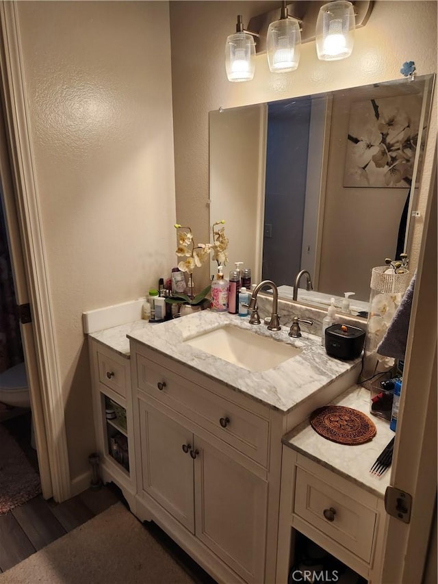 445 Almond Dr Unit 84, Lodi, CA 95240 - bathroom with vanity, wood finished floors, and toilet