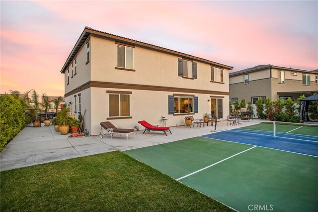 36275 Firelight Cir, Wildomar, CA 92595 - back of property featuring stucco siding, a tennis court, and a patio area